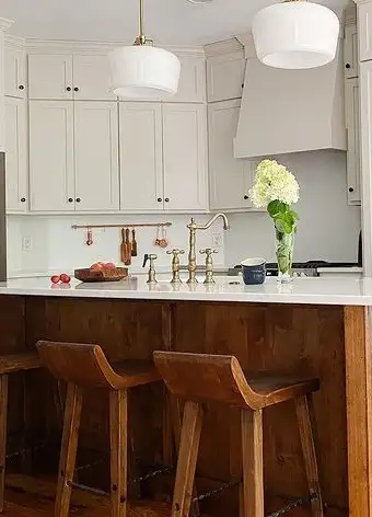 Designer Amanda Birdy Pierce-Home Designs uses Kingston Brass gold bridge kitchen faucet