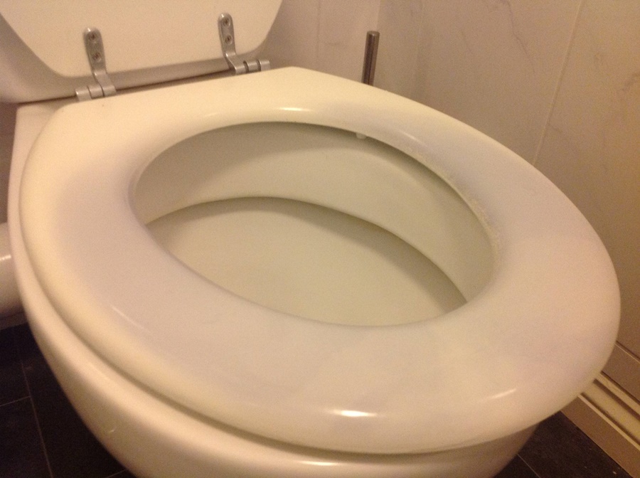 why is my toilet seat turning pink